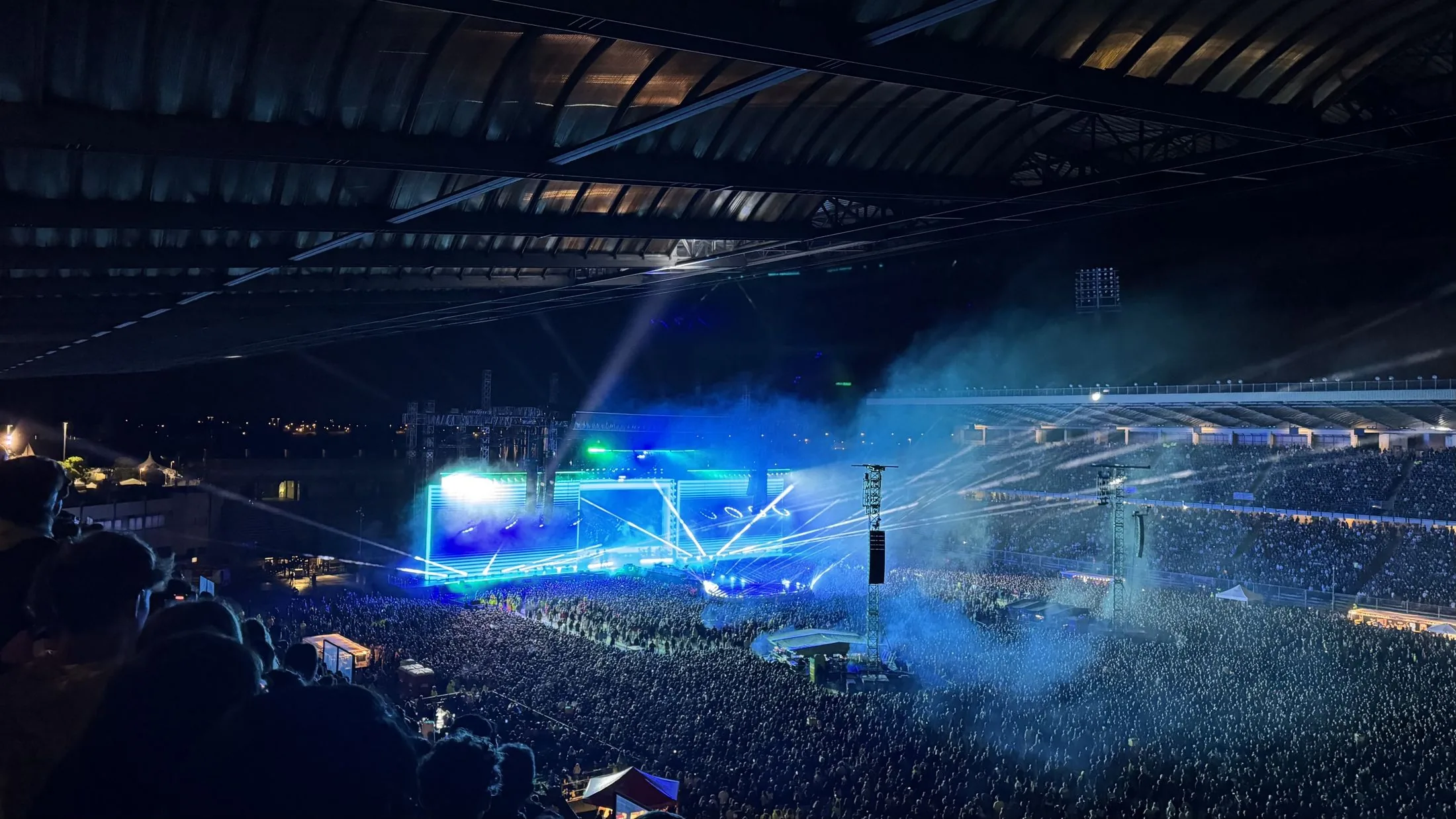 Jupiter at night, stadium with audience and blue light